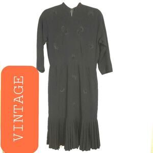 VINTAGE BLACK BEADED DRESS WITH PLEATED HEM